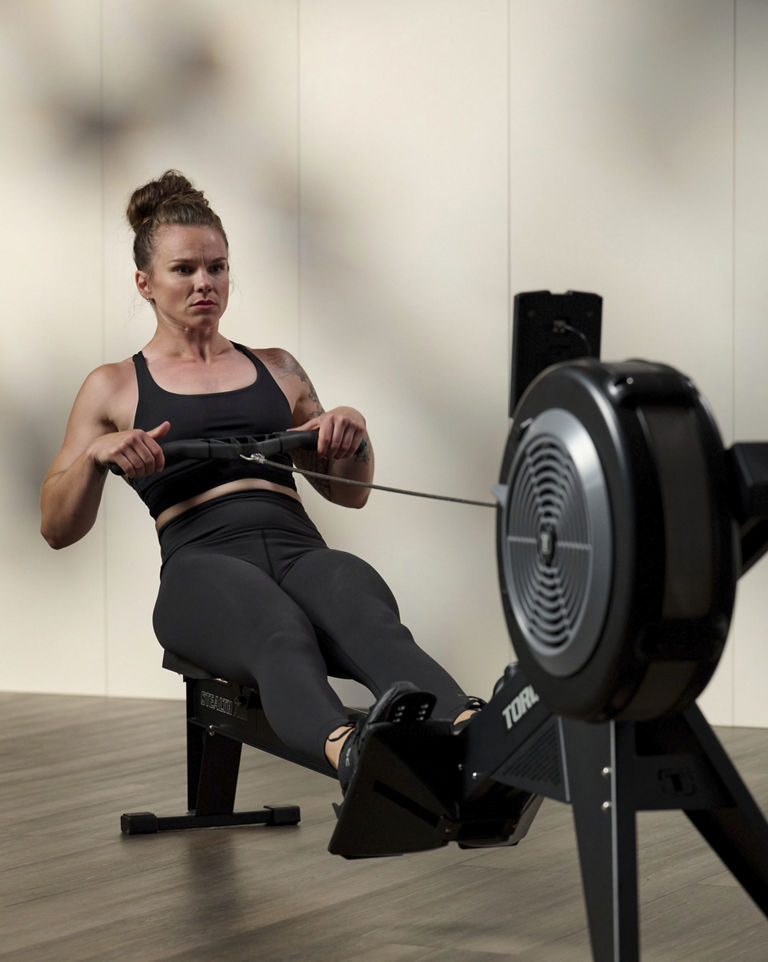 a woman doing a row workout