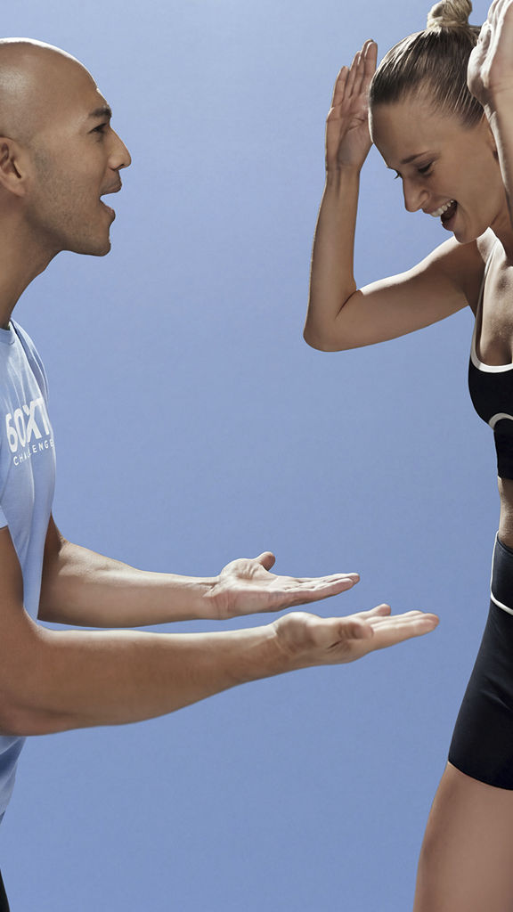 trainer and member celebrating