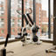 Strength training equipment on the fitness floor at the Life Time Atlantic Avenue club location