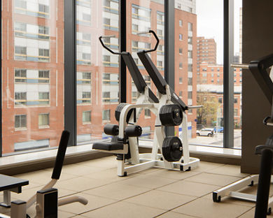 Strength training equipment on the fitness floor at the Life Time Atlantic Avenue club location