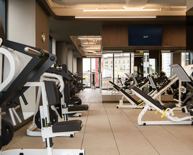 Strength training equipment on the fitness floor at the Life Time Atlantic Avenue club location