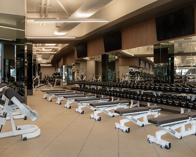 Strength training equipment on the fitness floor at the Life Time Atlantic Avenue club location