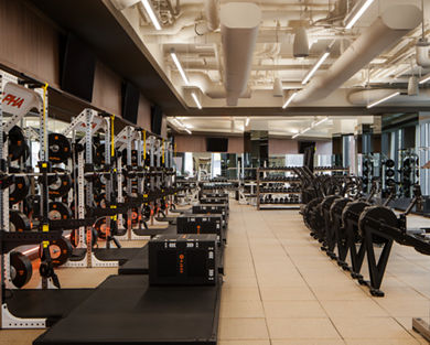 Strength training equipment on the fitness floor at the Life Time Atlantic Avenue club location