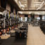 Strength training equipment on the fitness floor at the Life Time Atlantic Avenue club location