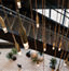 Top view of chandelier above a staircase at the Life Time Atlantic Avenue club location