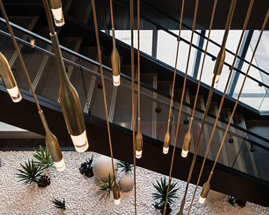 Top view of chandelier above a staircase at the Life Time Atlantic Avenue club location