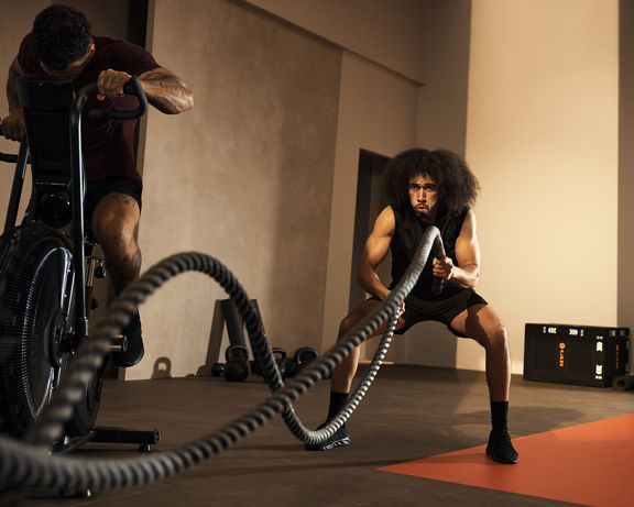Alpha class member working out with battle rope