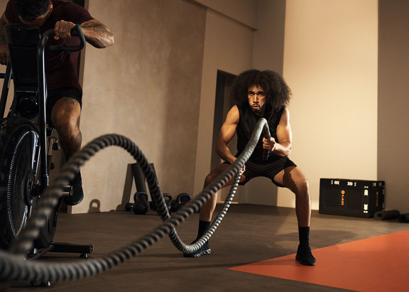 Alpha class member working out with battle rope