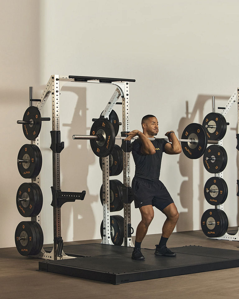 a man performing a clean and jerk