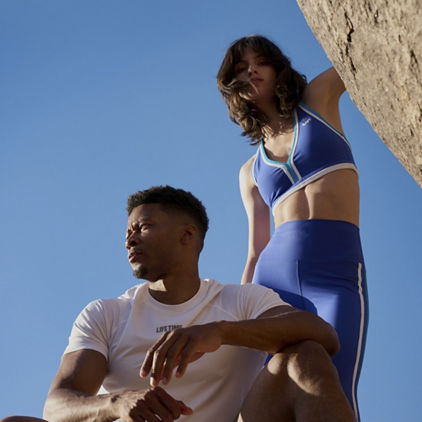 two people posing in workout clothes
