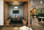 A Life Time workspace with a wooden floor, tables and a booth with cushioned benches