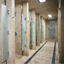 Row of shower stalls in a locker room at Life Time