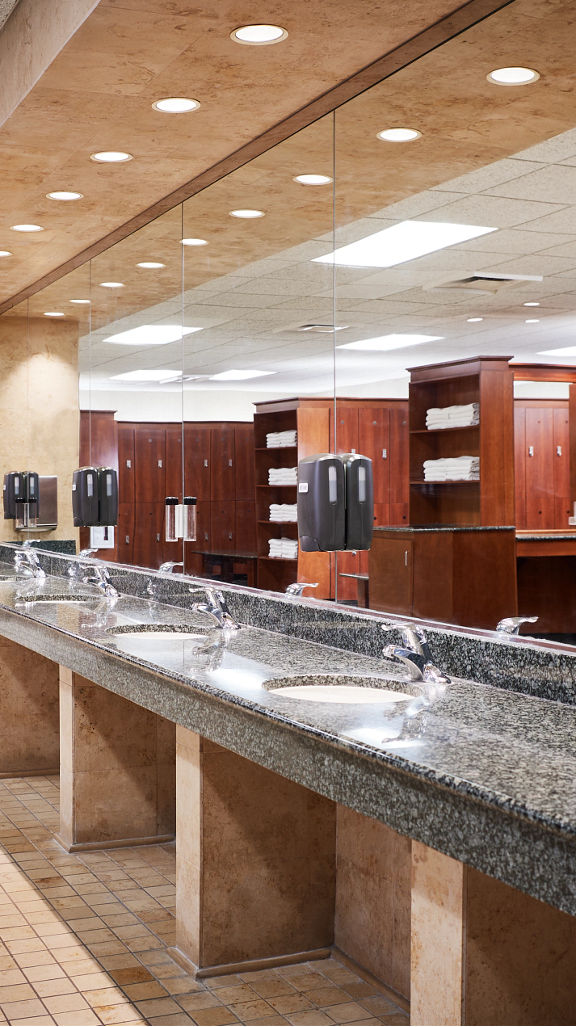 Row of sinks in a locker room at Life Time