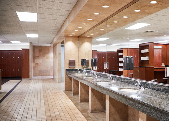 Row of sinks in a locker room at Life Time