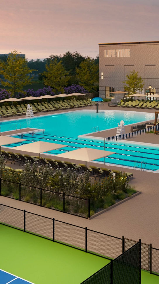 Exterior of Life Time Building with pools and courts
