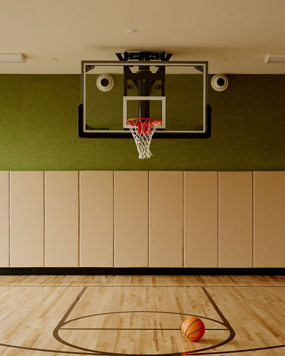 basketball court with a basketball sitting on the ground