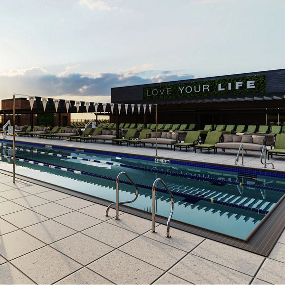 outdoor lap pool and lounging area at Life Time