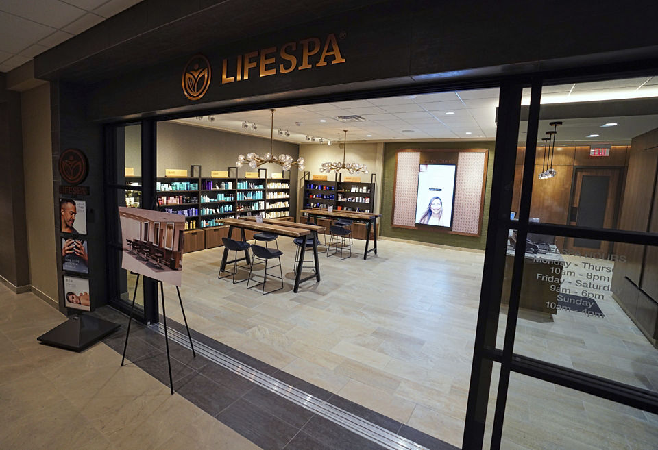 The entryway of the Lifespa, with tables and chairs, and products for sale