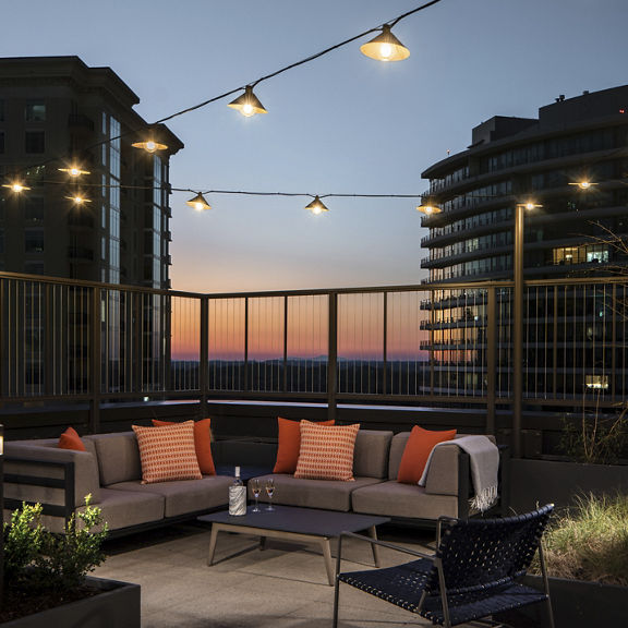 Rooftop outdoor seating area at dusk