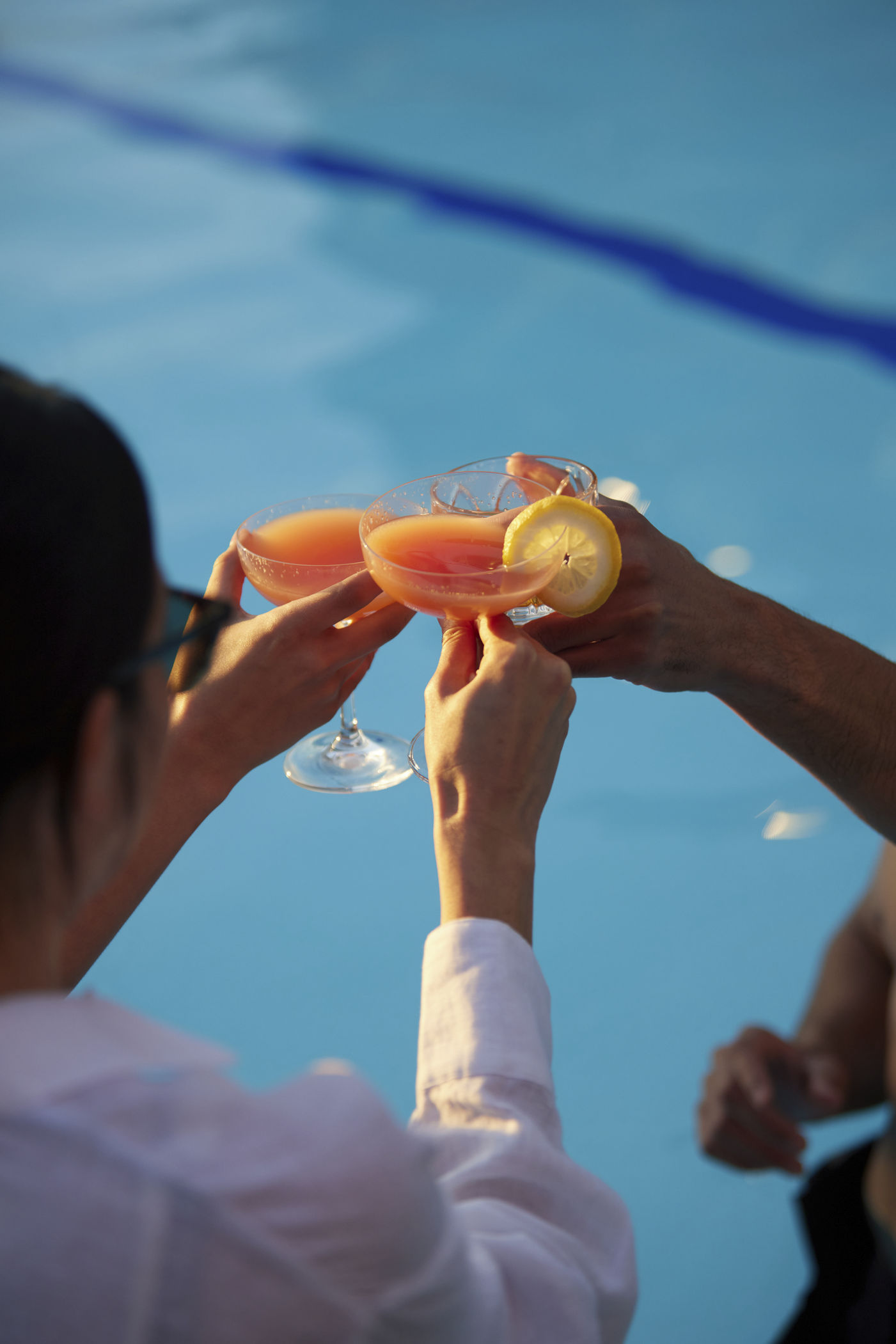 Life Time members enjoying fruity alcoholic drinks poolside