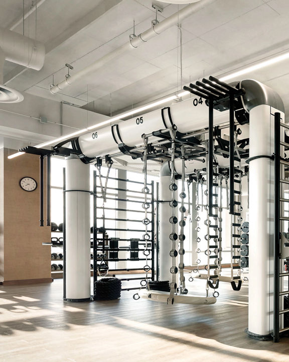 An outrace machine and other workout equipment on a Life Time fitness workout floor