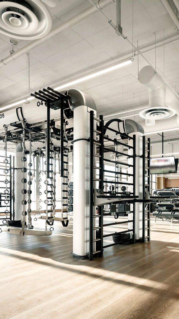 An outrace machine and other workout equipment on a Life Time fitness workout floor