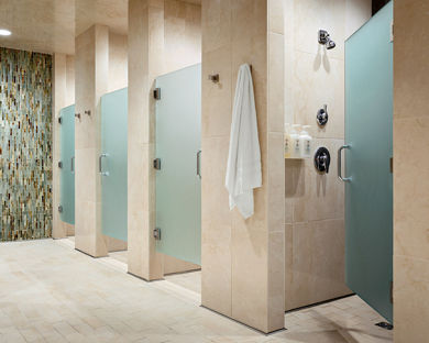 Shower stalls inside a locker room at Life Time