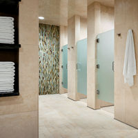 Shower stalls inside a locker room at Life Time