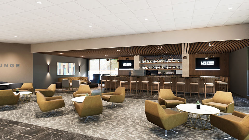 Lounge seating and a bar at Life Time Bloomington North