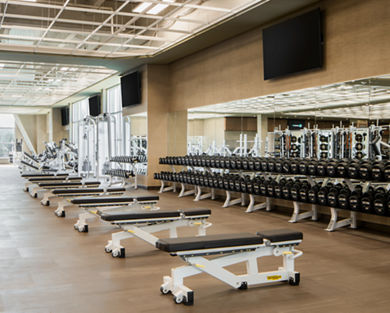 Weight benches on the fitness floor at Life Time