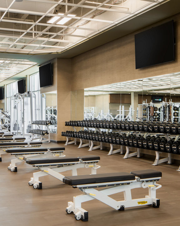 Weight benches on the fitness floor at Life Time