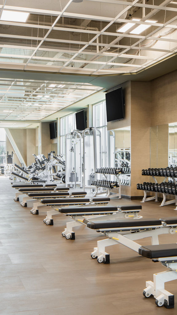 Weight benches on the fitness floor at Life Time