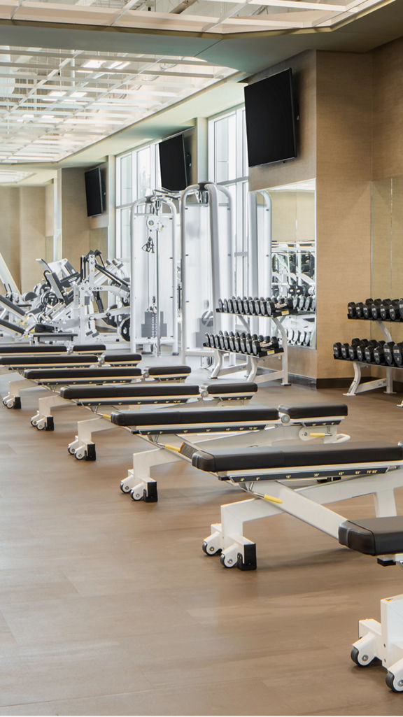 Weight benches on the fitness floor at Life Time