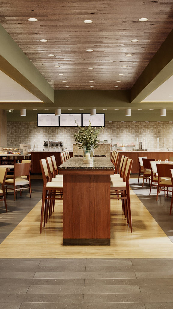 Tables, chairs, and booths in a warm dining environment