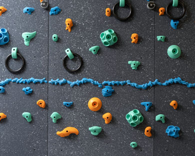 Climbing wall with colorful pegs