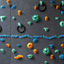 Climbing wall with colorful pegs