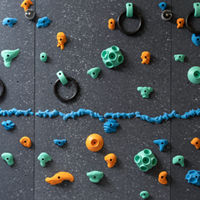 Climbing wall with colorful pegs