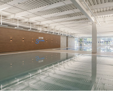 Brightly lit indoor leisure and lap pool at Life Time