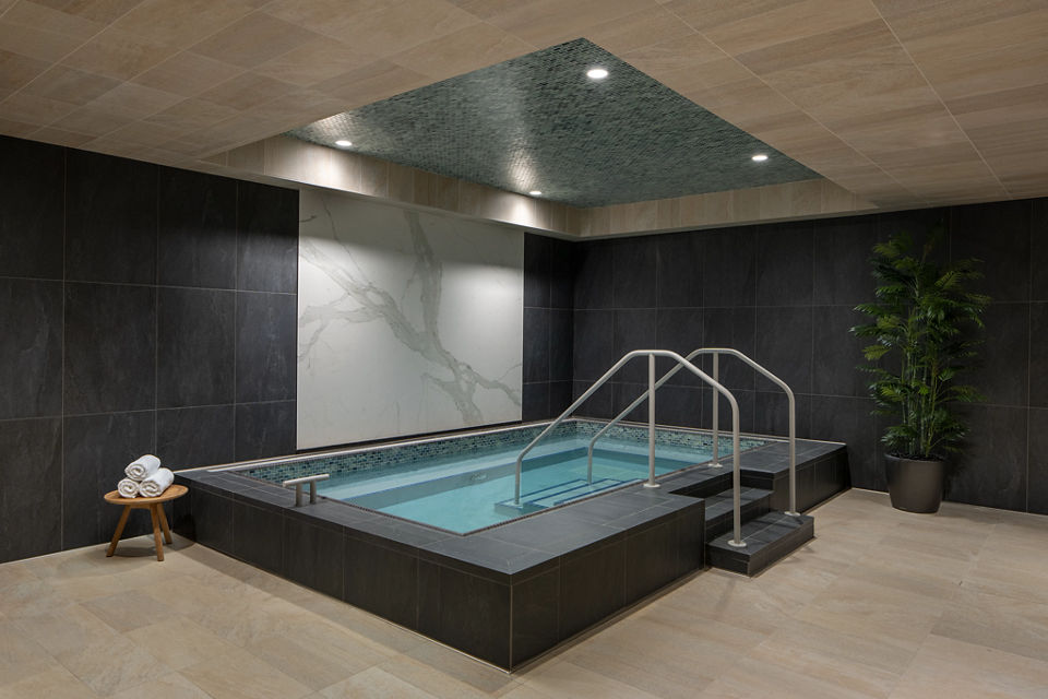 a luxury whirl pool area surrounded in marble