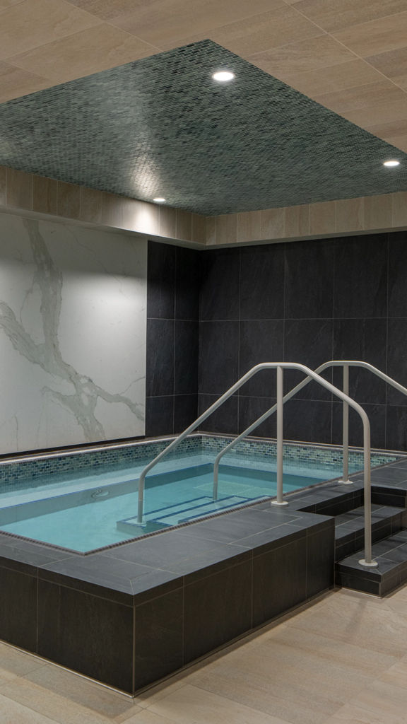 a luxury whirl pool area surrounded in marble