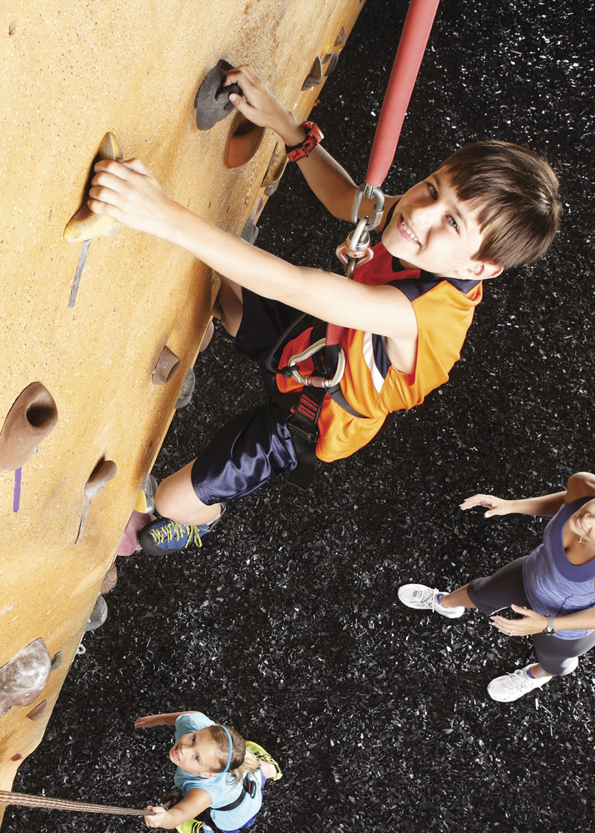 Family spending time on the climb wall.