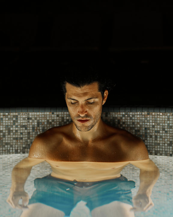 man sitting in water