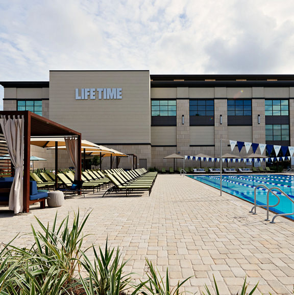 Outdoor lap pool and exterior of the Life Time Durango club location