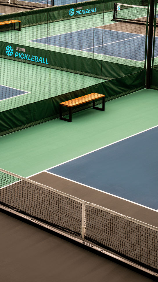 a group of indoor pickleball courts