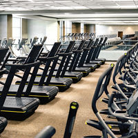 Rows of cardio equipment on the fitness floor at Life Time