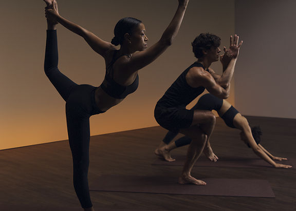 a group of people practicing yoga poses