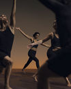 Flow yoga class participants in varying poses at Life Time