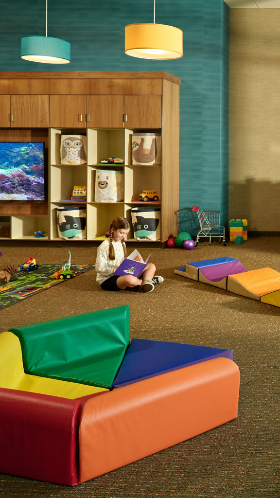 Toddler area with brightly colored toys in a Life Time Kids Academy