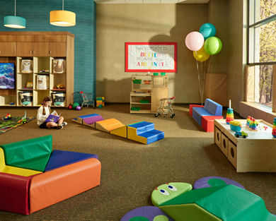 Toddler area with brightly colored toys in a Life Time Kids Academy