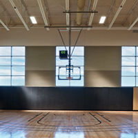 Gleaming, well-lit basketball court and gymnasium